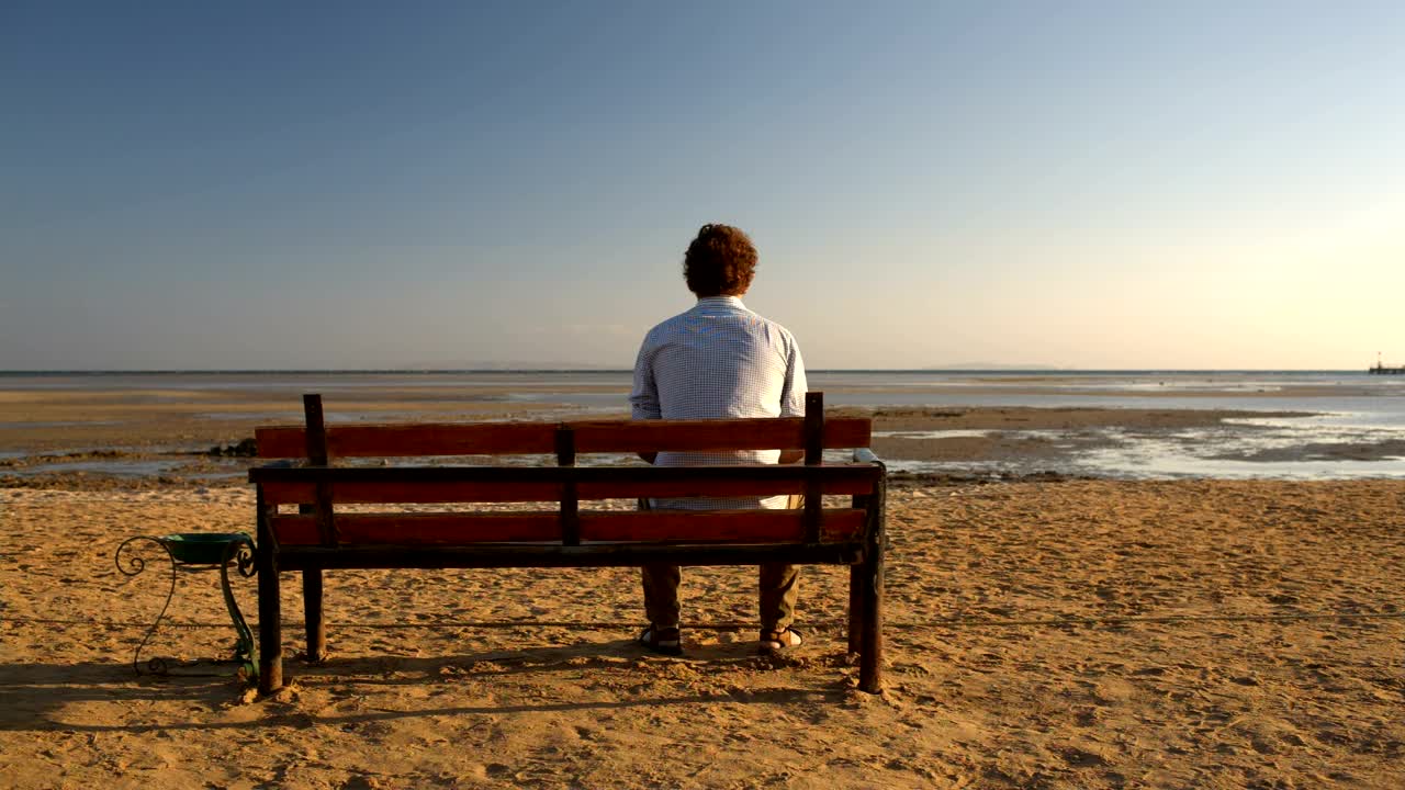Stock Video Man Sitting Alone On A Benc Animated Wallpaper - Free Download