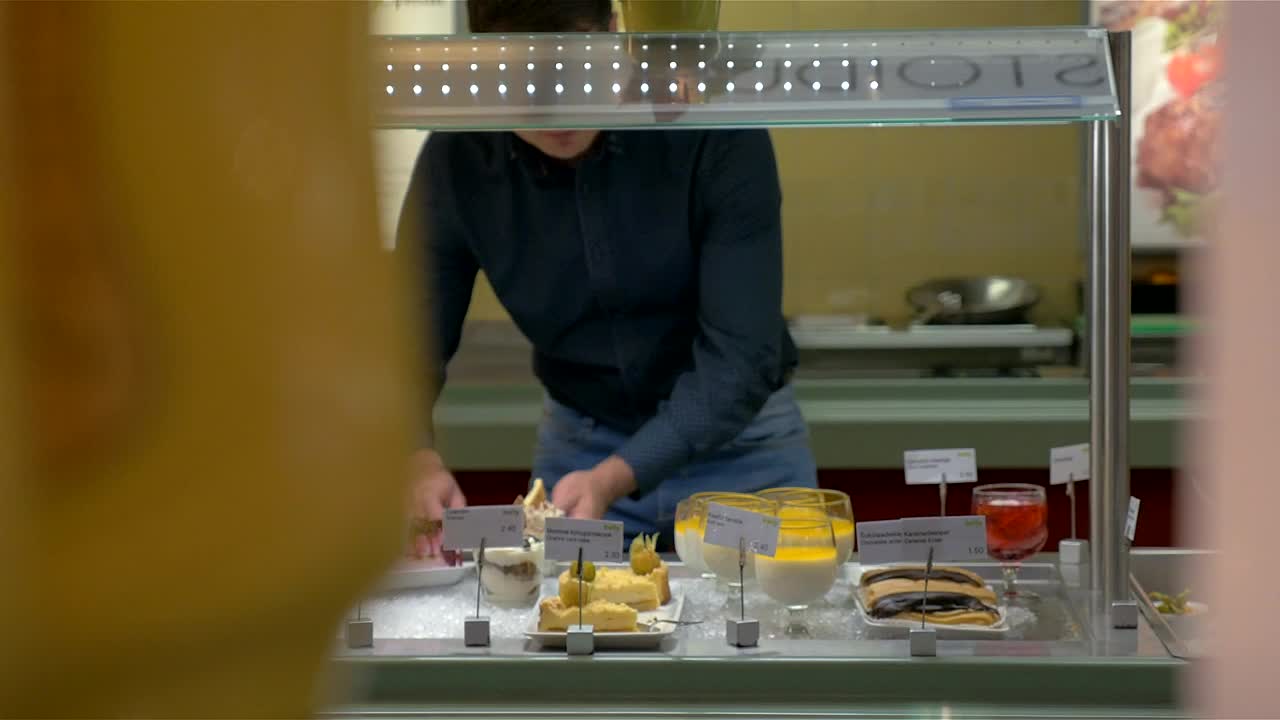 Stock Video Man Choosing Items From A Buffet Animated Wallpaper - Free Download