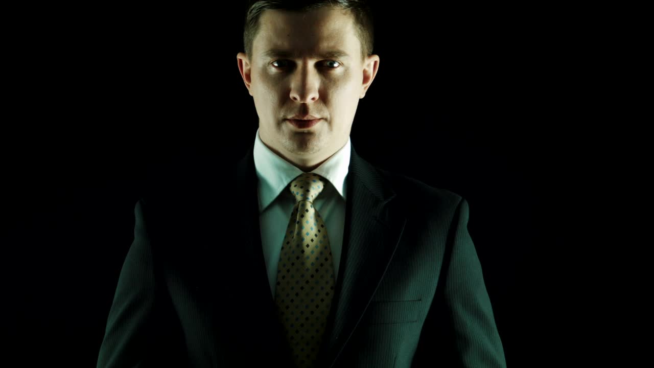 Stock Video Man In A Suit Put Money On His Mouth Animated Wallpaper - Free Download
