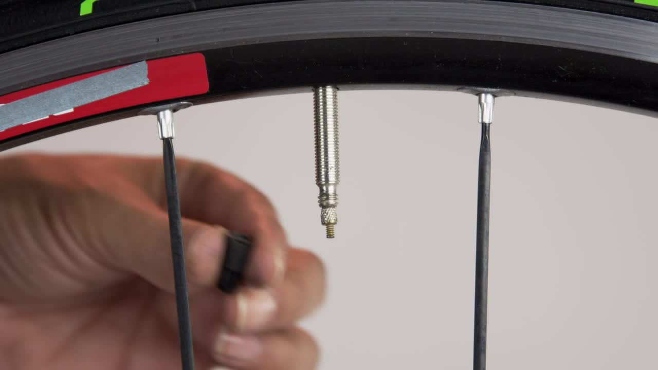 Stock Footage Valve Cap On A Bicycle Wheel Live Wallpaper - Free Download