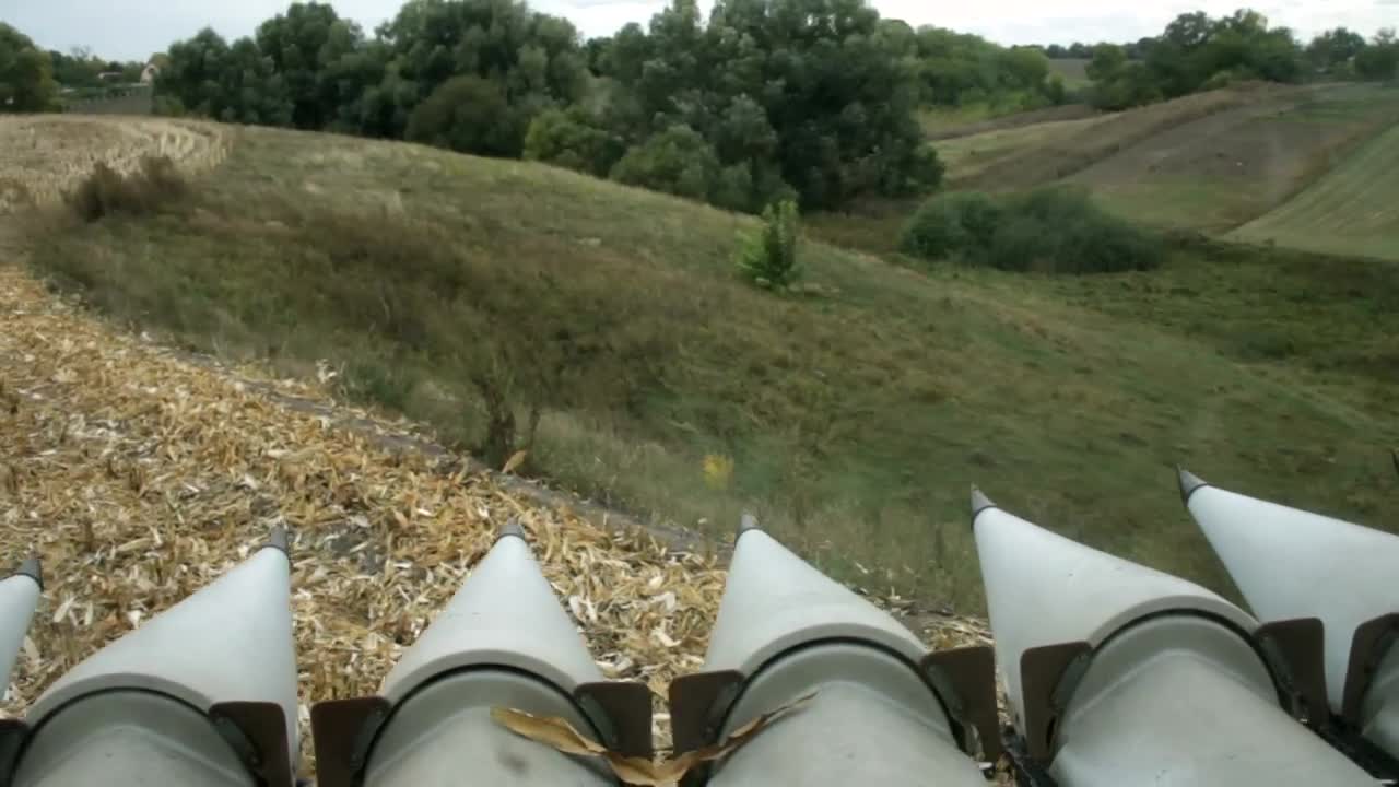 Stock Video Harvester Moving Through A Finished Field Animated Wallpaper - Free Download