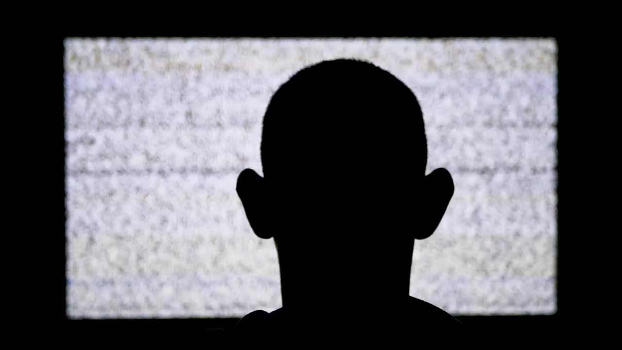 Free Stock Video Silhouette Of A Man In Front Of A Tv With Live Wallpaper - Free Download