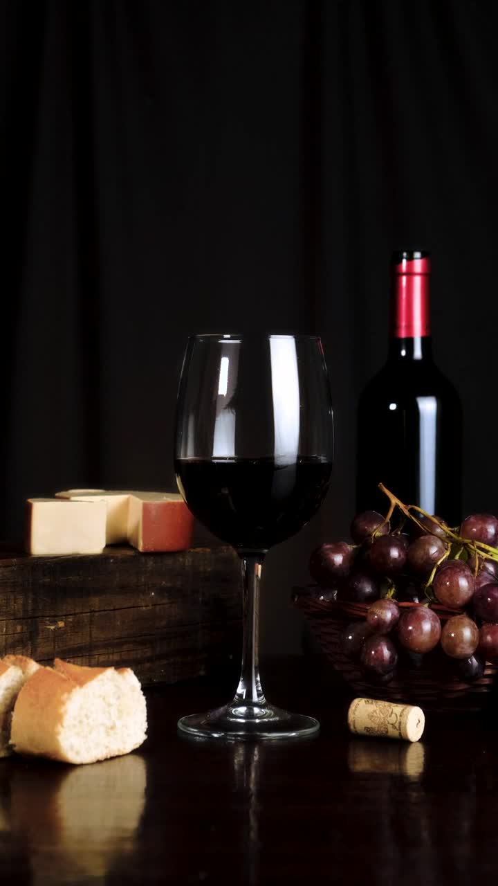 Stock Video Image Composition On A Table With Wine Cheese Grapes And Animated Wallpaper - Free Download
