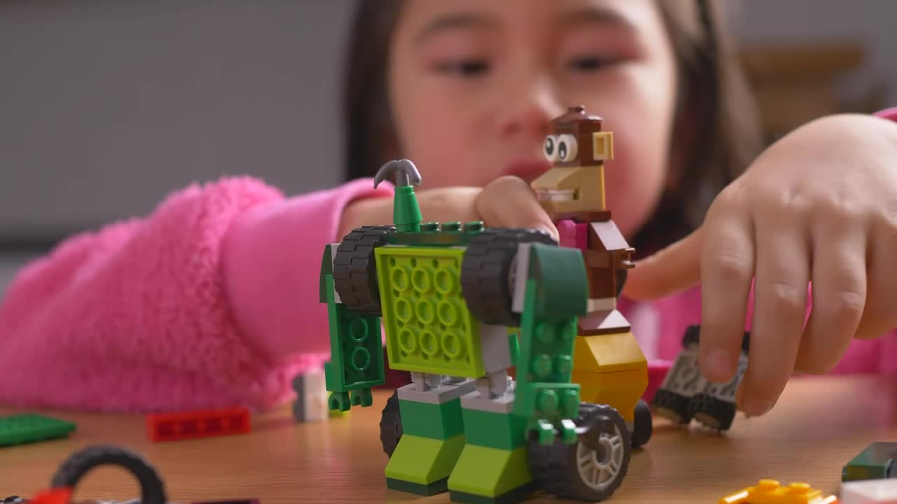 Stock Video Little Girl Playing With Lego Toys Animated Wallpaper - Free Download