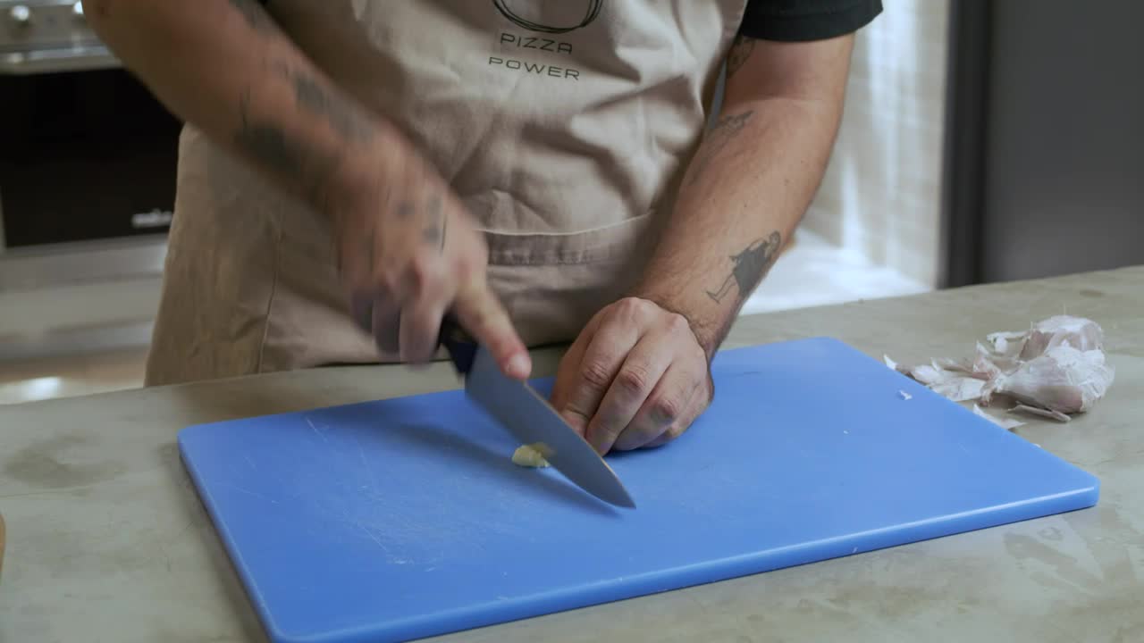 Video Stock Chef Skillfully Mincing A Garlic Live Wallpaper For PC - Free Download