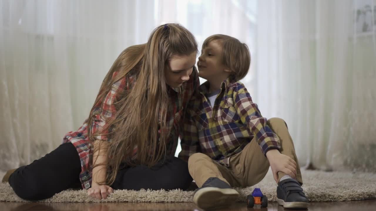 Stock Video Little Boy Whispers Secret In Sisters Ear Animated Wallpaper - Free Download