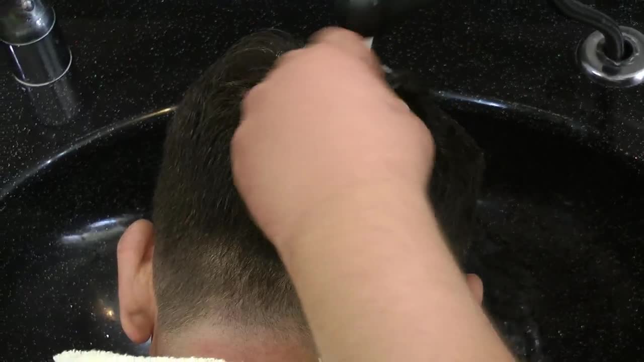 Stock Video Hairdresser Washing A Clients Hair Live Wallpaper For PC - Free Download