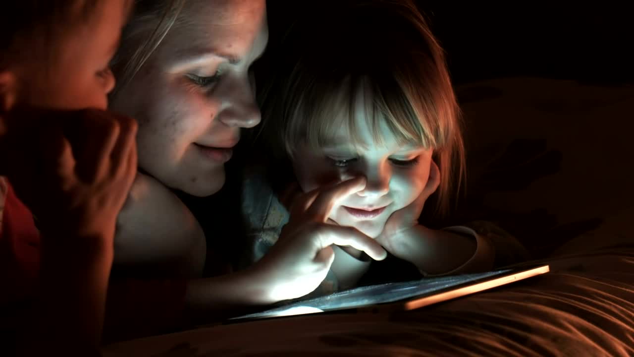 Stock Video Family Of Three Watching The Tablet In The Bedroom Live Wallpaper For PC - Free Download