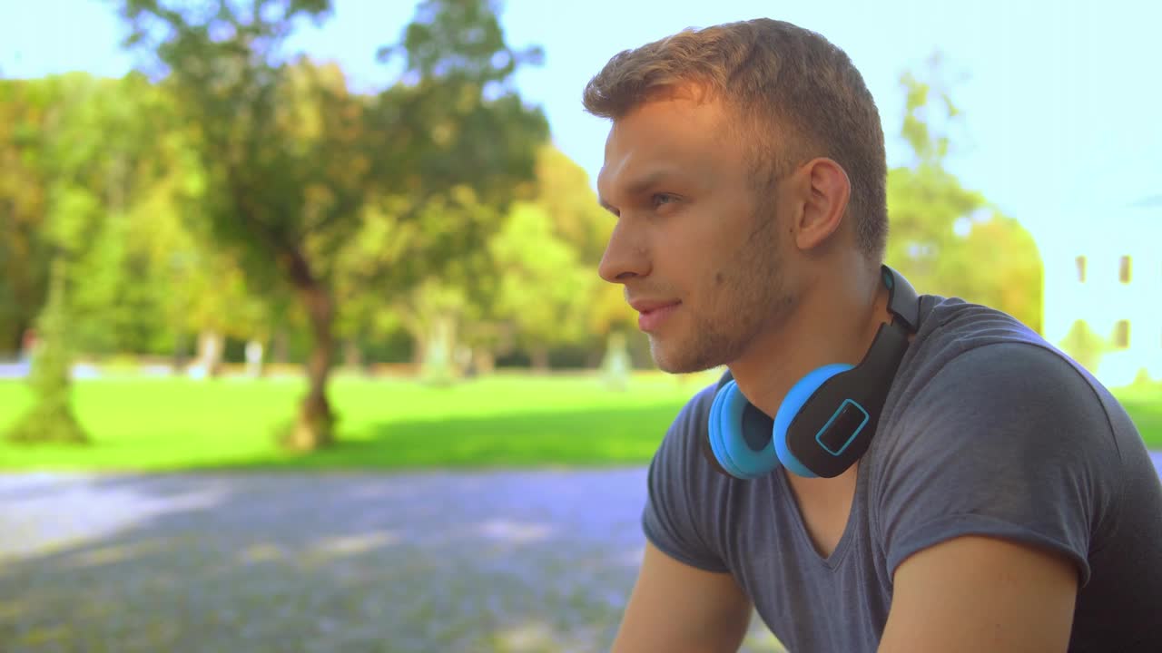 Stock Video Pensive Young Man Listening To Music On His Headphones Live Wallpaper - Free Download
