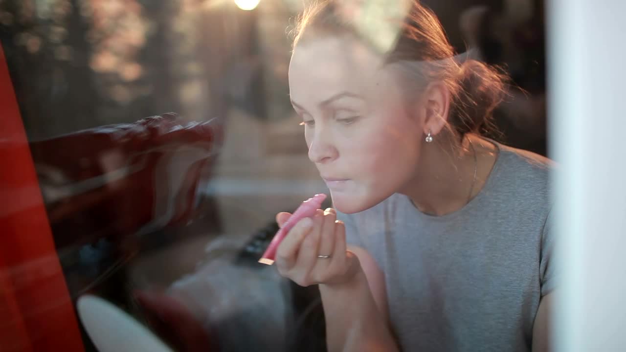 Stock Footage Woman Applying Pink Lip Gloss Live Wallpaper - Free Download