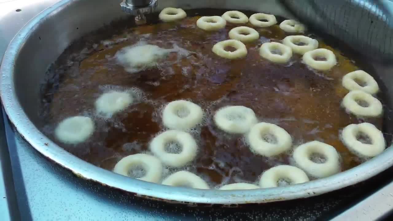 Stock Video Industrial Production Of Fried Donuts Animated Wallpaper - Free Download