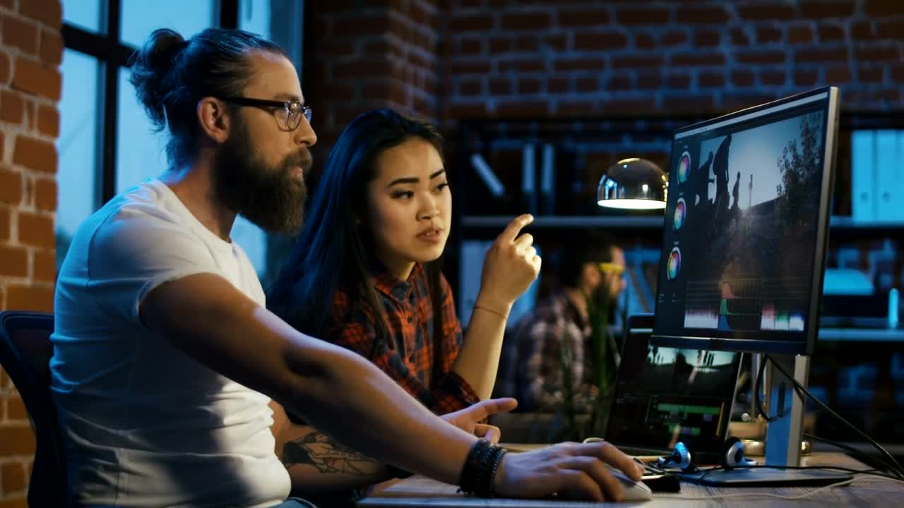 Stock Video Coworkers Editing Video On The Computer Live Wallpaper For PC - Free Download