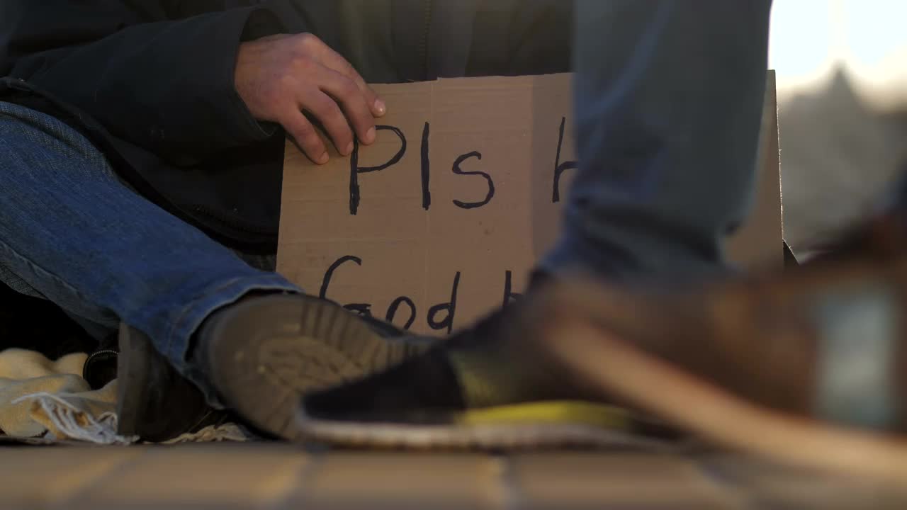 Video Stock Cardboard Sign Of A Homeless Man On The Street Live Wallpaper For PC - Free Download