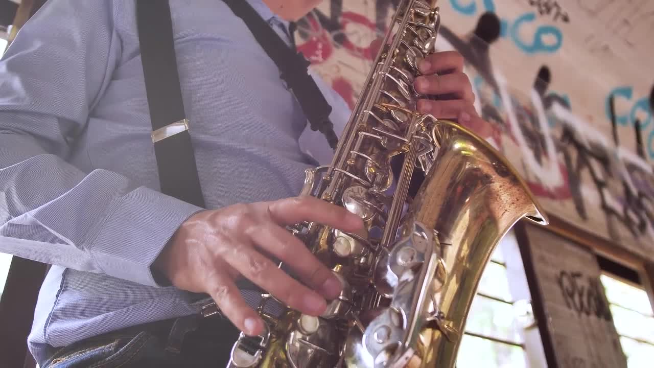 Video Stock Close Up Of A Saxophonist In An Abandoned Spot Live Wallpaper For PC - Free Download