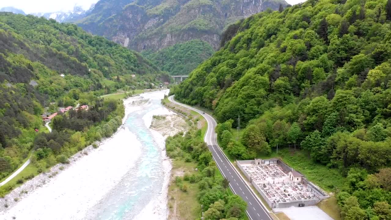 Stock Video Flying Over A Cemetery And A Road By The River Live Wallpaper For PC - Free Download