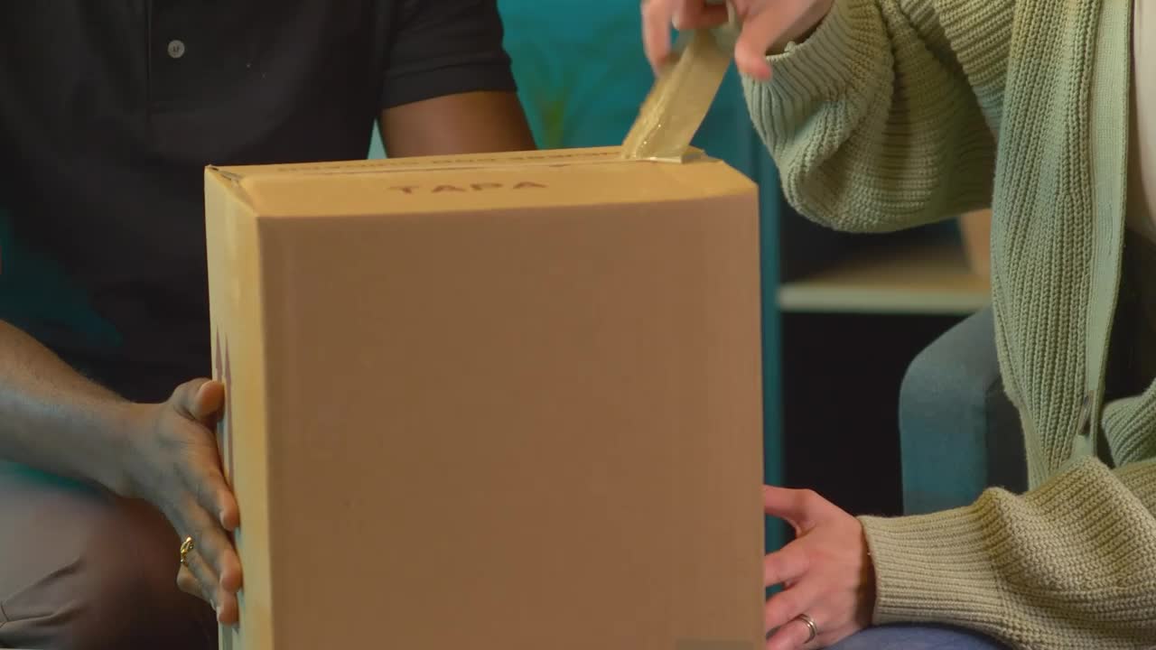 Stock Video Couple Opening A Package With An Alarm Clock Live Wallpaper For PC - Free Download