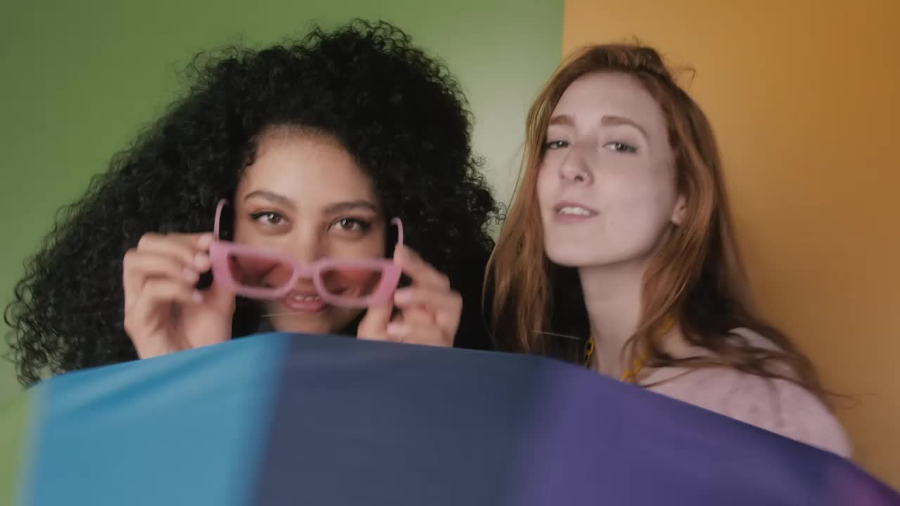 Free Stock Video Two Girls Having Fun With A Colorful Umbrella Live Wallpaper - Free Download
