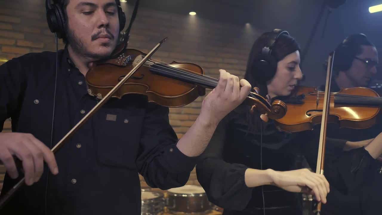 Free Video Stock three violinists playing together in a recording studio 41690Live Wallpaper - Free Download