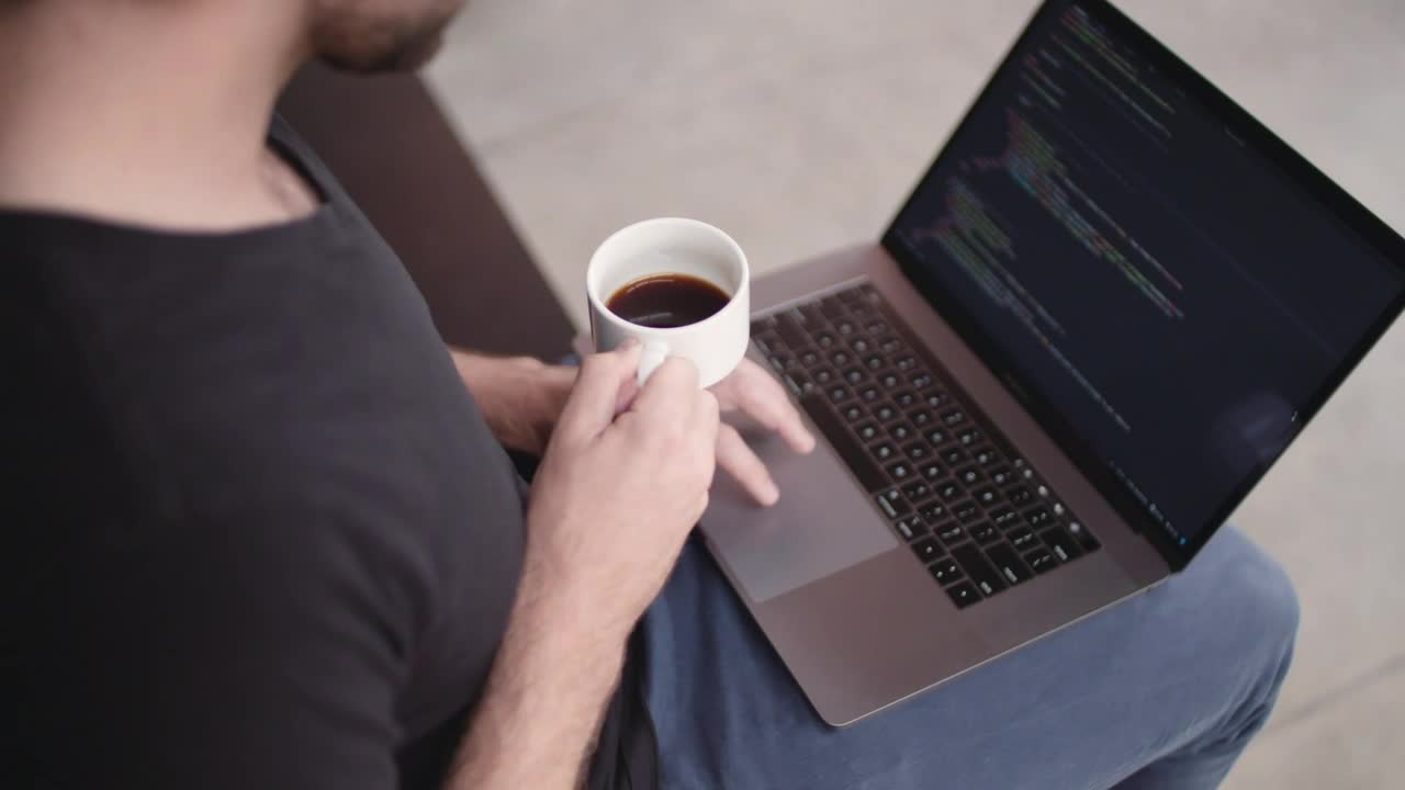 Free Video Stock Software Developer Holding A Coffee Cup Live Wallpaper - Free Download