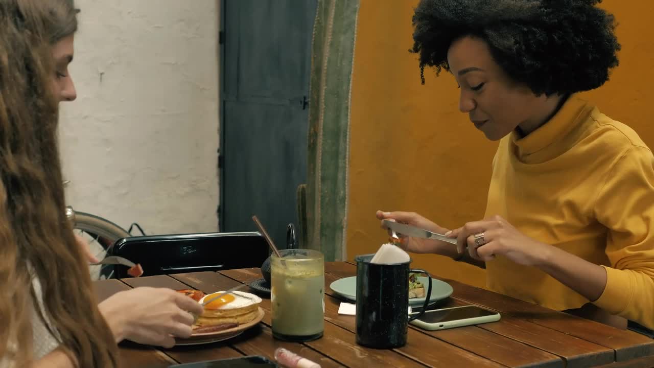 Stock Video Couple Of Girls Having Breakfast Together In A Restaurant Live Wallpaper For PC - Free Download