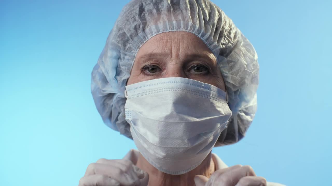 Free Stock Video Serious Doctor Takes Off Mask Portrait Live Wallpaper - Free Download