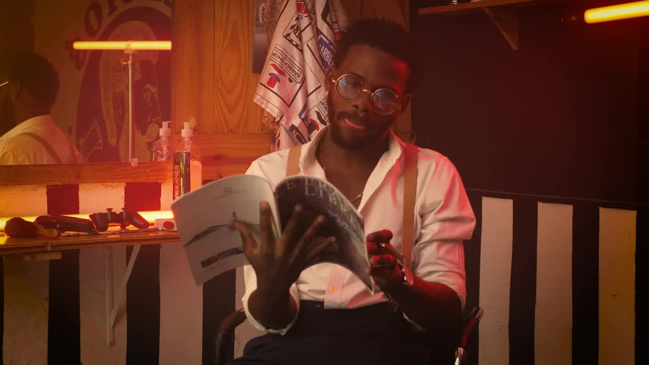 Free Stock Video Young Barber Hanging Out Sitting In His Barbershop Live Wallpaper - Free Download