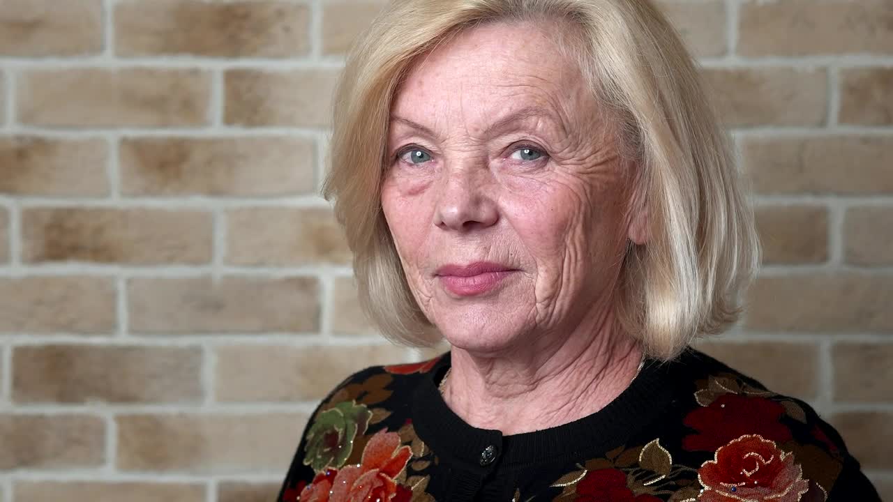 Stock Video Elderly Woman Looking Straight Into The Camera Live Wallpaper For PC - Free Download