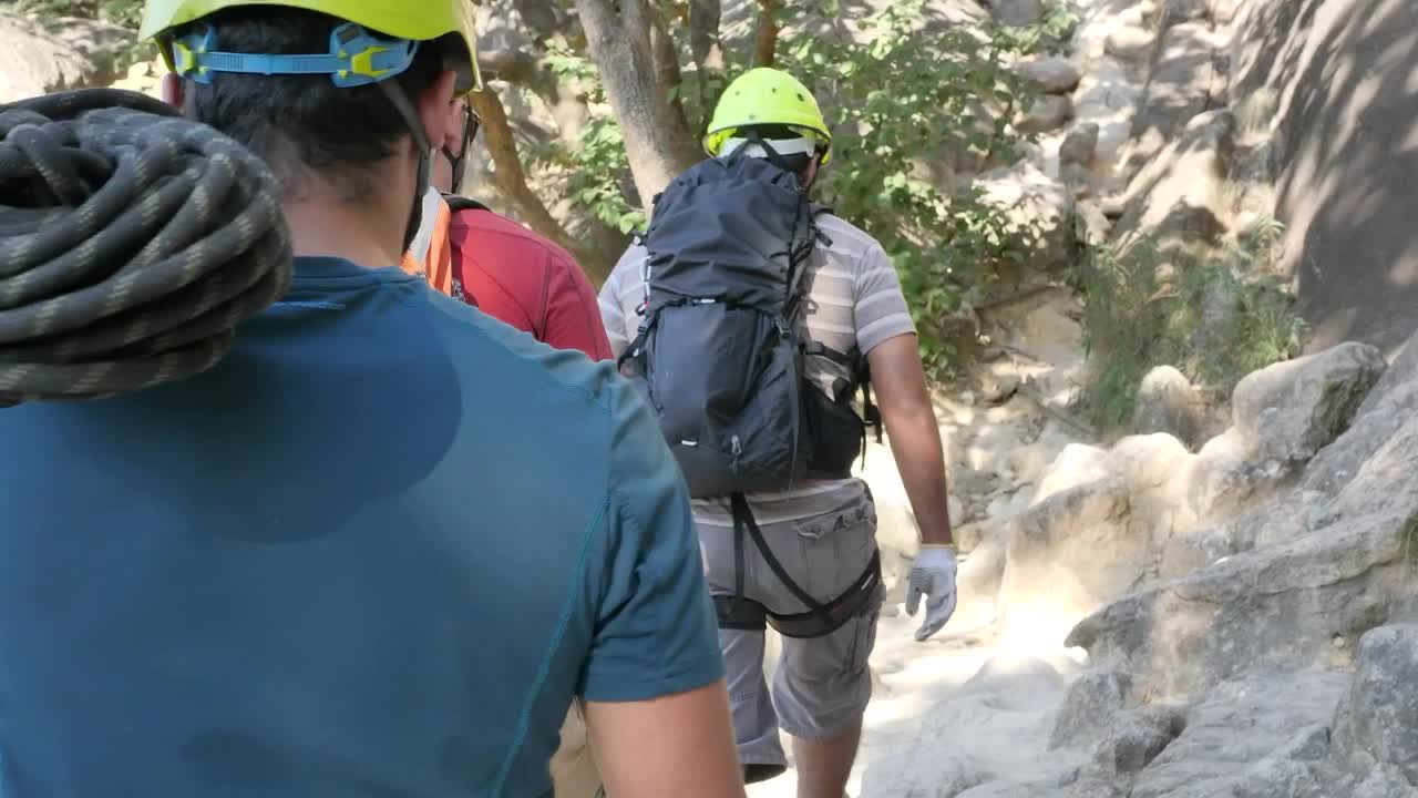 Stock Video Mountaineers Walking Around A Mountain In Nature Live Wallpaper - Free Download