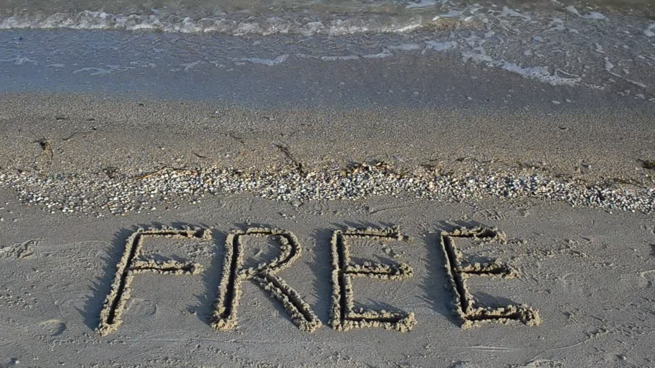 Free Stock Video Word Free Written In The Sand On A Sunny Beach Live Wallpaper - Free Download