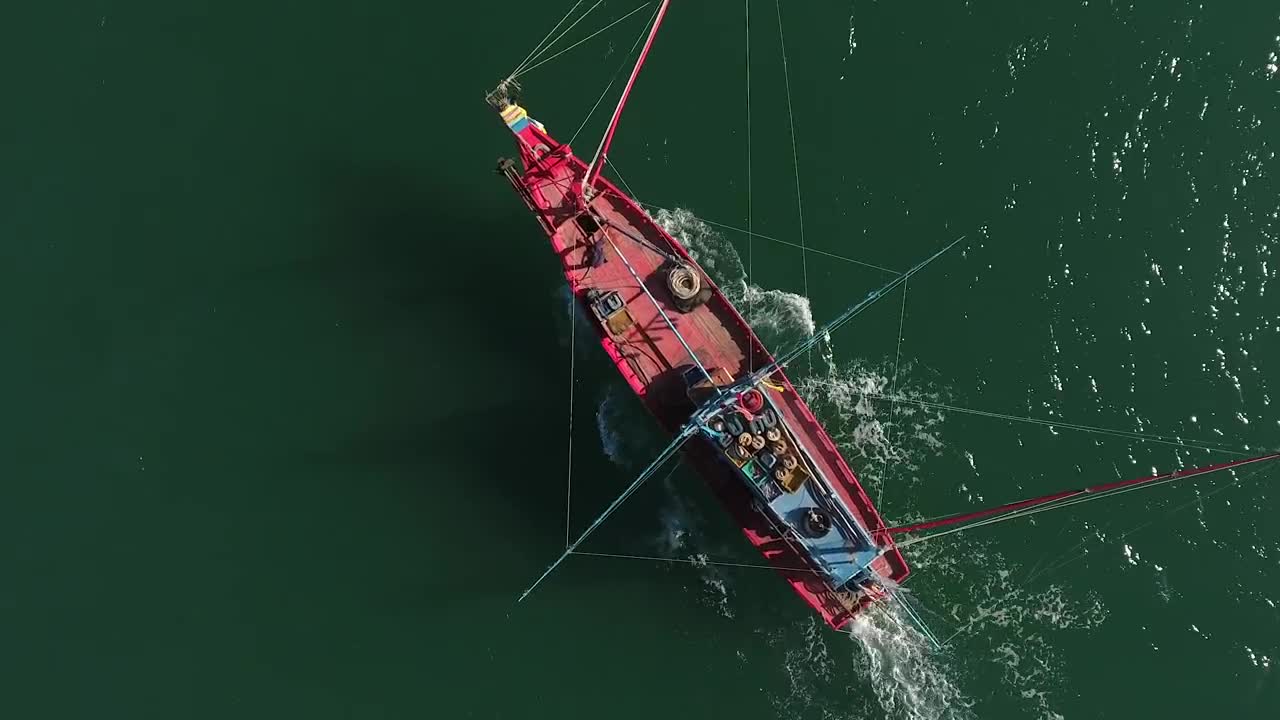 Stock Video Drone Following A Small Red Fishing Boat Live Wallpaper For PC - Free Download
