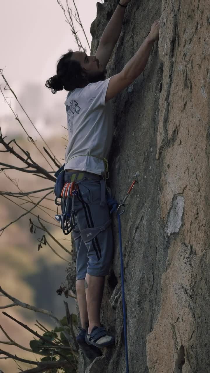 Stock Video Mountaineer Climbing A Rocky Vertical Mountain Live Wallpaper - Free Download