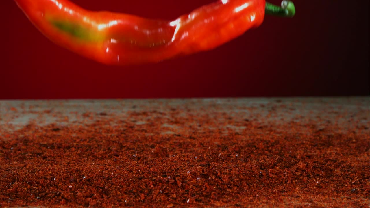 Stock Video Big Red Pepper Falling Into Red Powder Live Wallpaper For PC - Free Download