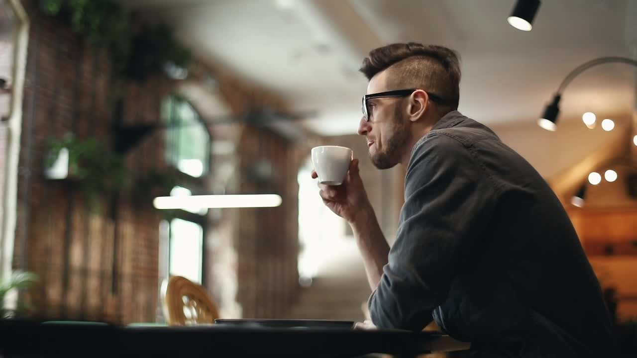 Stock Video Developer Types On Laptop In Cafe And Sips Coffee Live Wallpaper For PC - Free Download