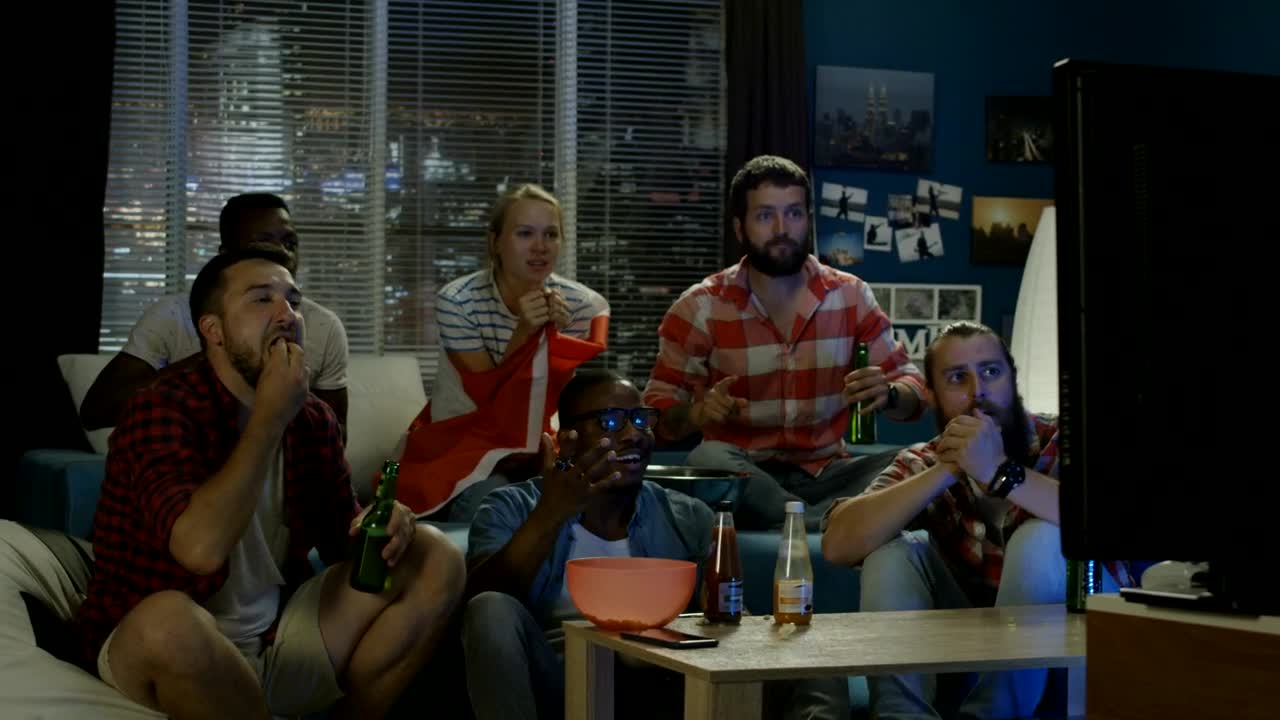 Stock Video Excited Friends Celebrating In Front Of The Tv Live Wallpaper For PC - Free Download