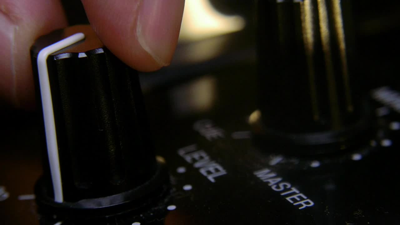 Free Video Stock touching the knobs on a dj mixer Live Wallpaper - Free Download