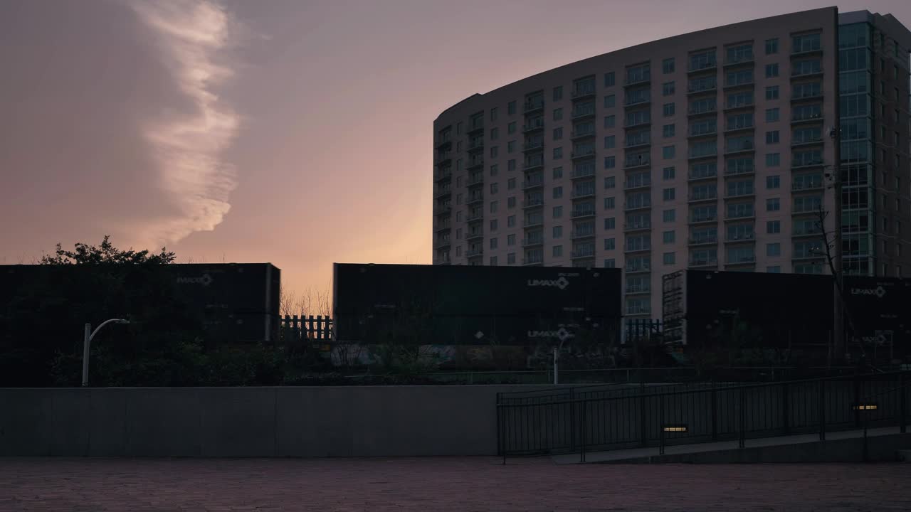 Free Video Stock train carriages moving forward in a city at sunset Live Wallpaper - Free Download