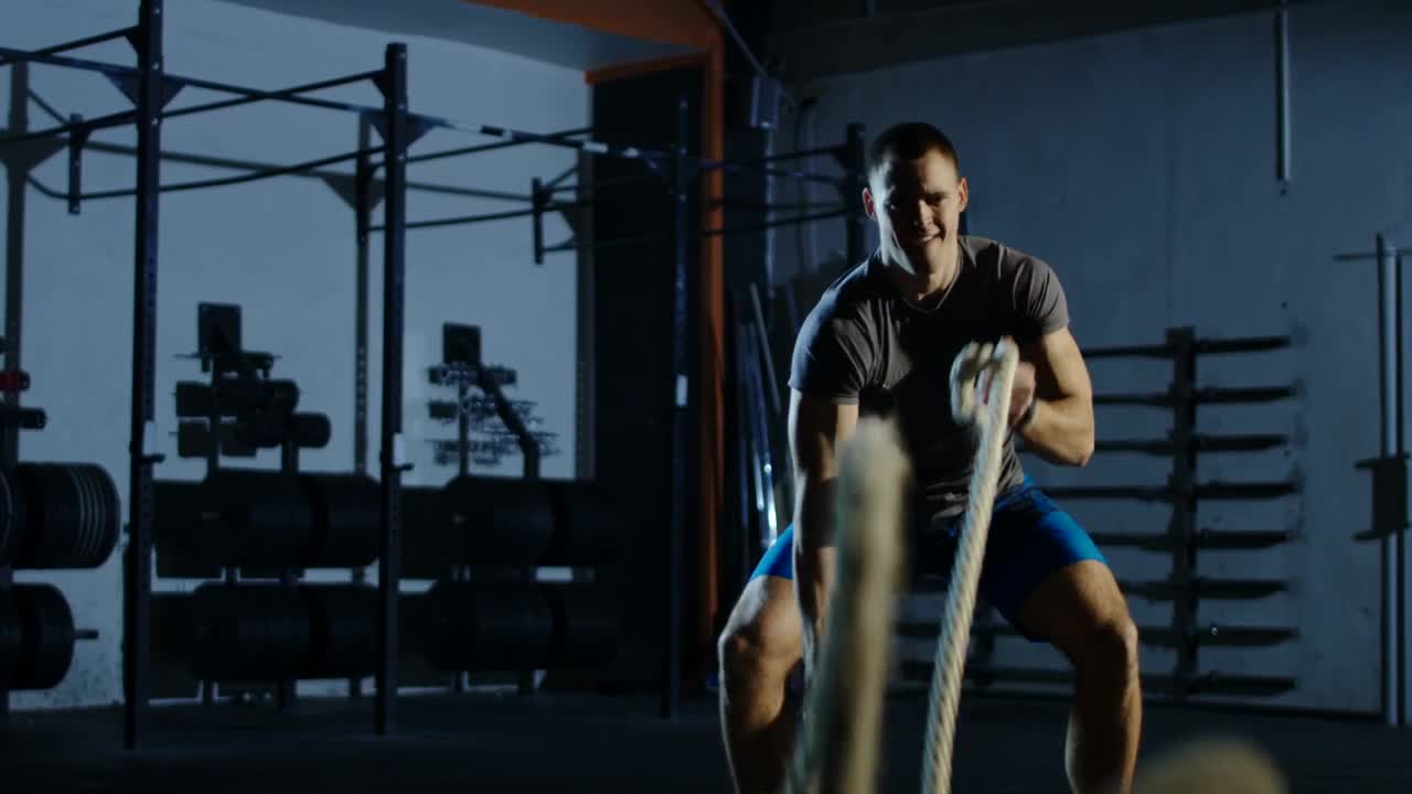 Stock Video Man Training With Ropes In The Gy Animated Wallpaper - Free Download