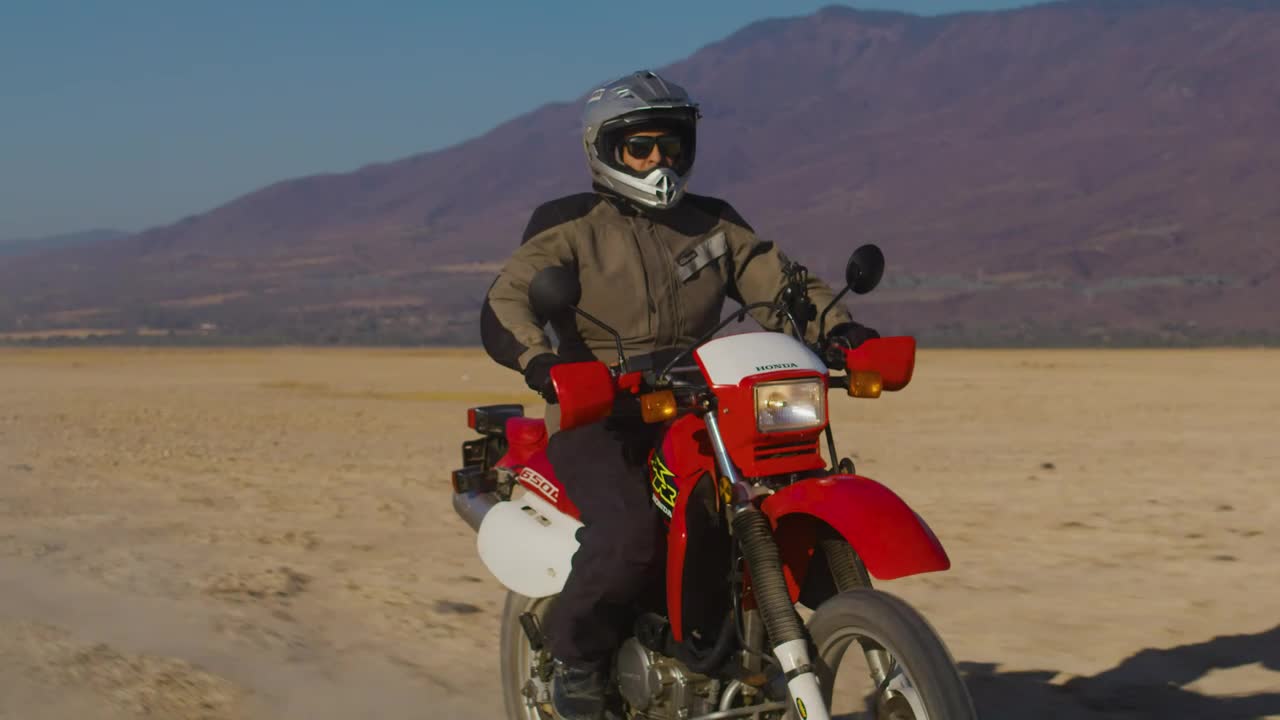 Stock Video Motorcyclist In The Arid Desert Live Wallpaper - Free Download