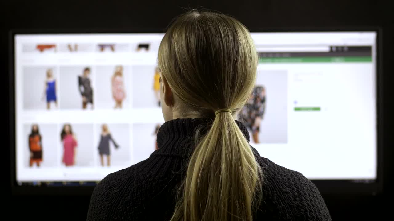 Stock Footage Woman Browsing A Fashion Website Back View Live Wallpaper - Free Download