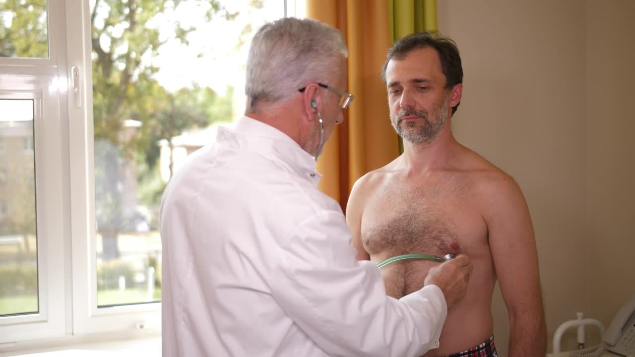 Stock Video Doctor Examining A Male Patient Live Wallpaper For PC - Free Download