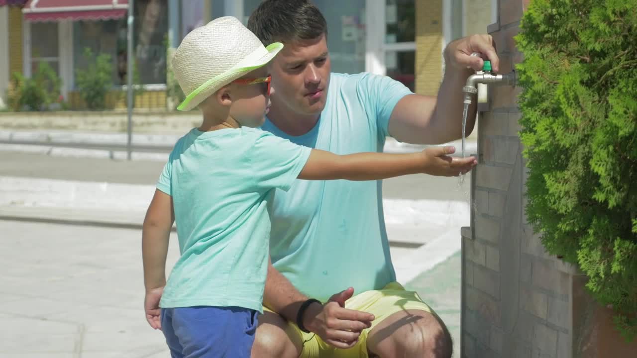 Stock Footage Using A Public Fountain To Wash Live Wallpaper - Free Download