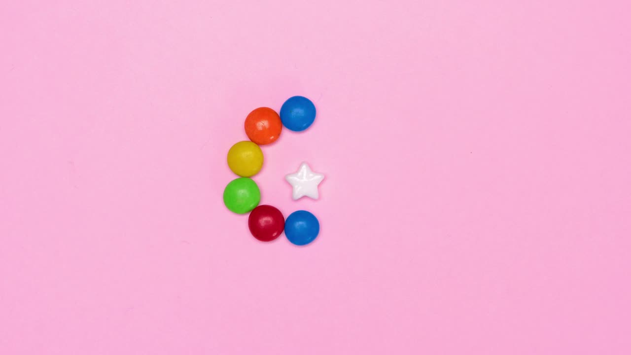 Free Video Stock Star Candy Surrounded By Chocolates On A Pink Background Live Wallpaper - Free Download