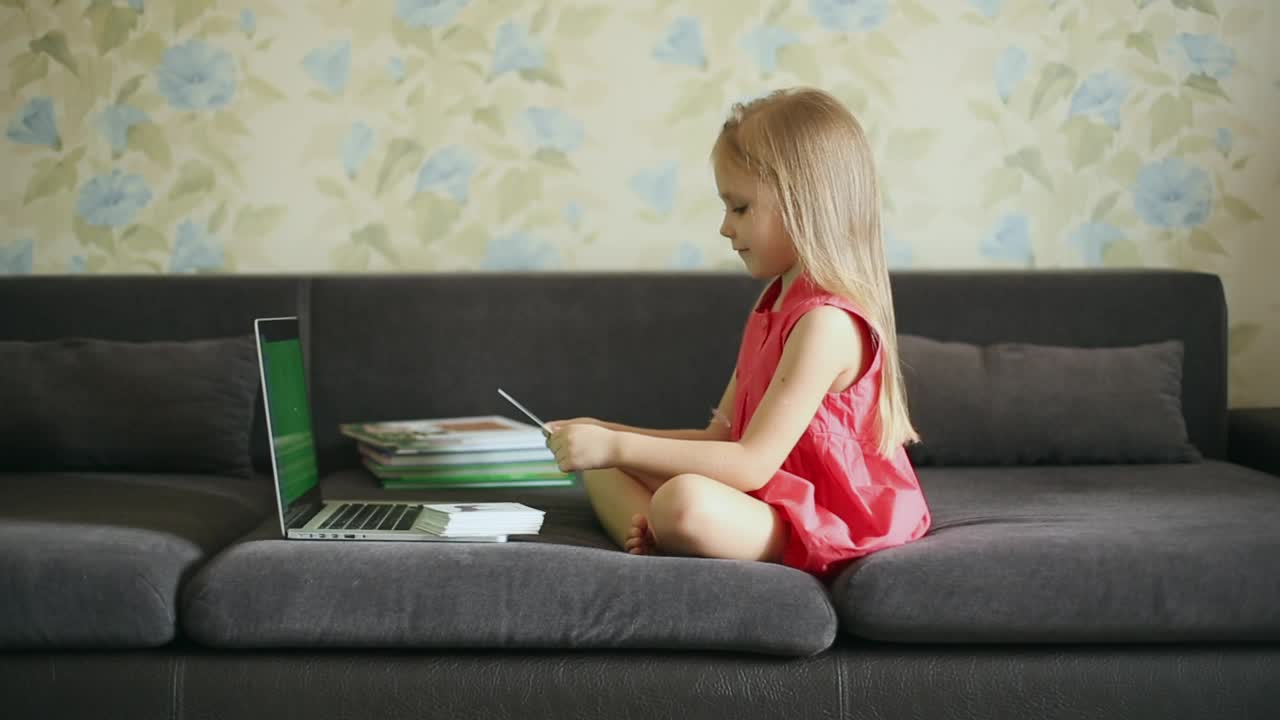 Stock Video Little Girl Taking Her Classes On The Couch Animated Wallpaper - Free Download