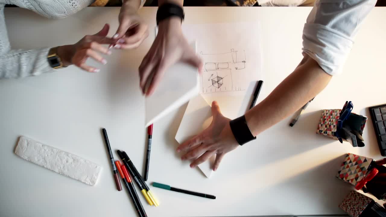Free Video Stock top view of creative hands working on paper models and Live Wallpaper - Free Download