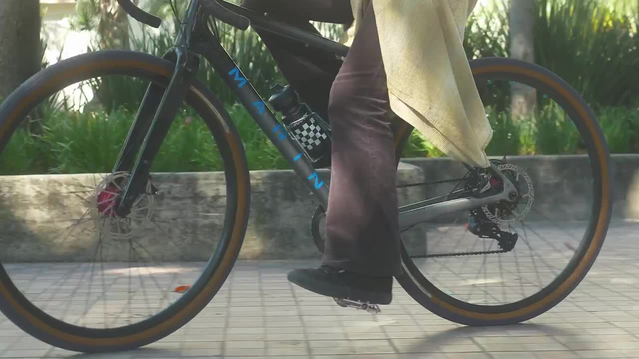Stock Video Pedaling Of A Girl On A Bicycle In A Park Live Wallpaper - Free Download