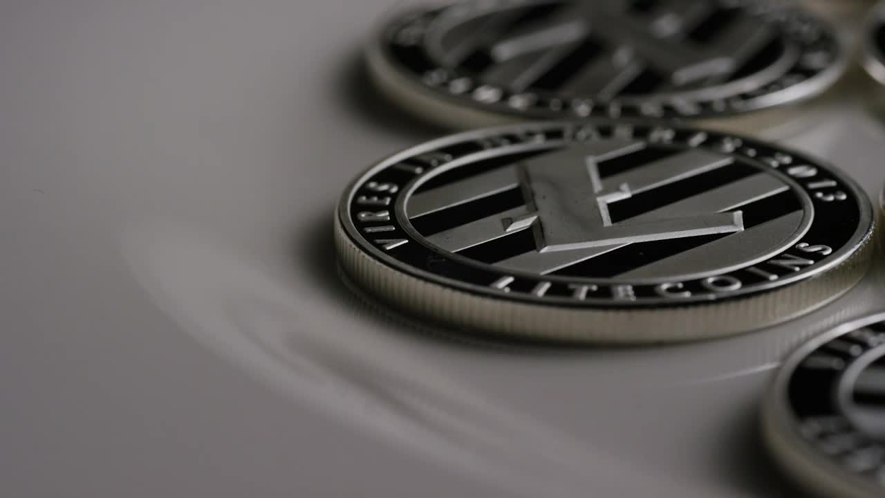 Stock Video Elegant Litecoin Coins Slowly Rotating Live Wallpaper For PC - Free Download