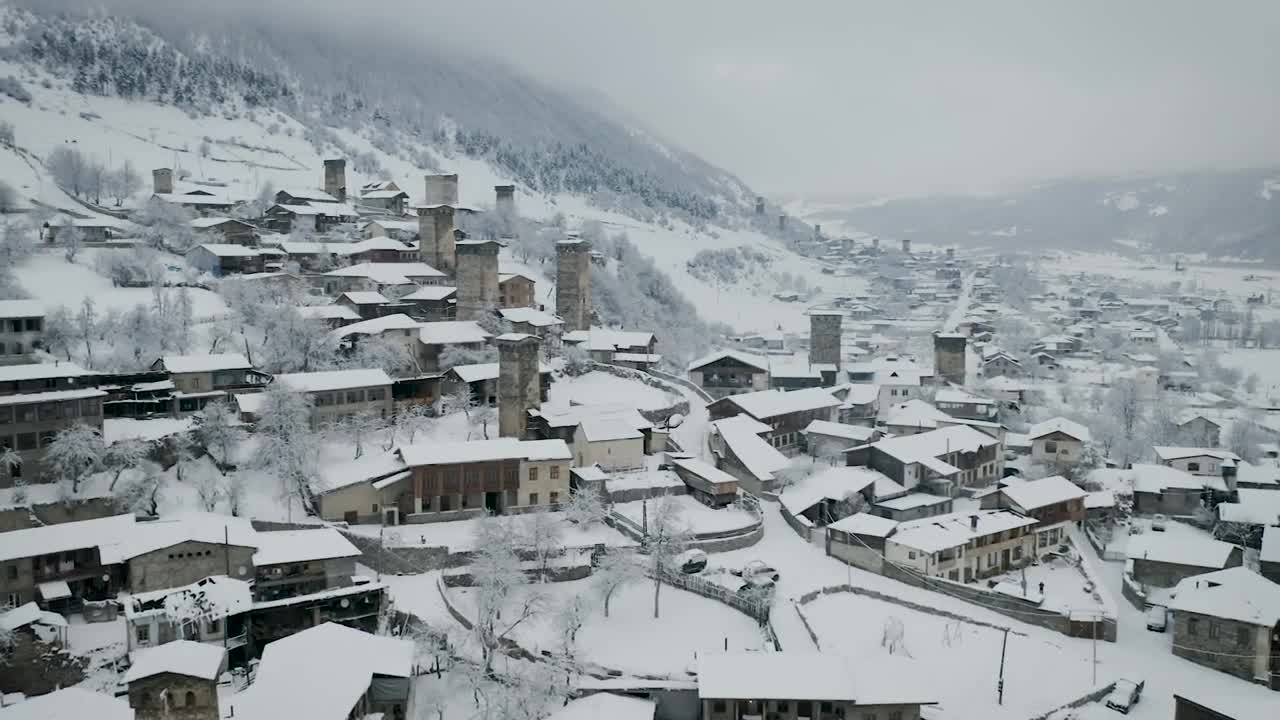 Stock Video Flying Above A Town With Old Towers Covered In Snow Live Wallpaper For PC - Free Download