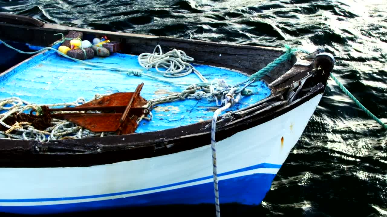 Free Video Stock Small Anchored Fishing Boat Seen In Detail Live Wallpaper - Free Download