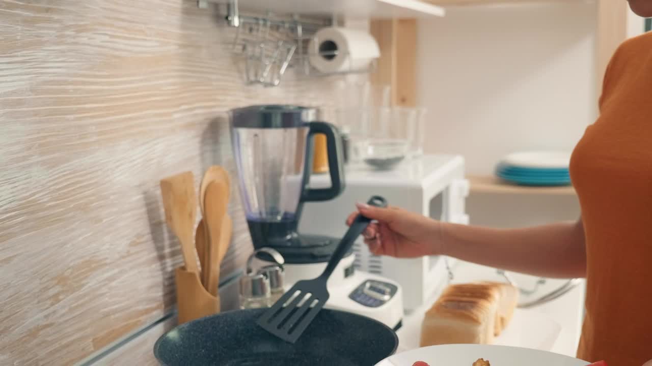 Stock Video Housewife Cooking Breakfast In The Kitchen Animated Wallpaper - Free Download