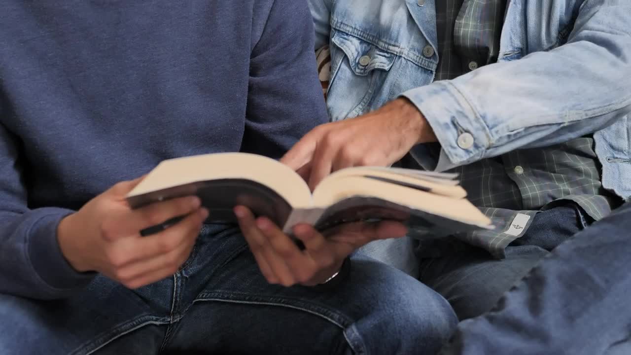 Free Stock Video Two Men Reading A Book Together Live Wallpaper - Free Download